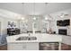 Spacious kitchen with stainless steel appliances and a seamless view into the cozy living and dining areas at 16112 Lakeside Loop Ln, Cornelius, NC 28031