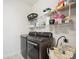 Laundry room featuring front load washer and dryer with metal shelving providing ample storage space at 16112 Lakeside Loop Ln, Cornelius, NC 28031