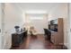 Comfortable home office setup with hardwood floors and natural light at 16112 Lakeside Loop Ln, Cornelius, NC 28031