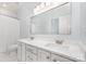 Modern bathroom with double sinks, white cabinetry, countertop, large mirror and bath/shower combo at 1654 Scotch Pine Ln, Fort Mill, SC 29708