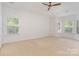 Spacious bedroom with natural light, carpeting, and neutral walls at 1654 Scotch Pine Ln, Fort Mill, SC 29708