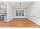 Bright dining room with hardwood floors, wainscoting, and large window at 1654 Scotch Pine Ln, Fort Mill, SC 29708