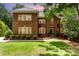 Beautiful brick home with manicured lawn and landscaping, showcasing classic architectural details at 1654 Scotch Pine Ln, Fort Mill, SC 29708