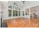 Spacious living room with hardwood floors, vaulted ceiling, and large windows at 1654 Scotch Pine Ln, Fort Mill, SC 29708