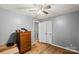 Bedroom with hardwood floors, neutral walls, and an expansive closet for ample storage at 205 Pinehurst Dr, Kings Mountain, NC 28086
