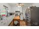 An inviting kitchen featuring white cabinets and stainless appliances at 205 Pinehurst Dr, Kings Mountain, NC 28086