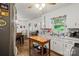 A sunlit kitchen features a stainless steel sink and neutral cabinetry at 205 Pinehurst Dr, Kings Mountain, NC 28086
