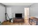 Living room with hardwood floors, a TV, a vintage trunk, and neutral-colored walls at 205 Pinehurst Dr, Kings Mountain, NC 28086