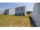Large backyard features a flat lot with newly installed grass and is ready for entertaining at 2210 Transatlantic Ave, Charlotte, NC 28215