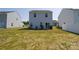 Large backyard features a flat lot with newly installed grass and is ready for entertaining at 2210 Transatlantic Ave, Charlotte, NC 28215