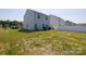 Large backyard features a flat lot with newly installed grass and is ready for entertaining at 2210 Transatlantic Ave, Charlotte, NC 28215