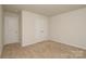 Bedroom featuring neutral carpet, double door closet, and ample room at 2210 Transatlantic Ave, Charlotte, NC 28215