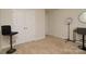 Bedroom includes carpet floors, neutral walls, and closet with double doors at 2210 Transatlantic Ave, Charlotte, NC 28215
