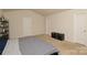 Well-lit bedroom with neutral carpet, vaulted ceiling, and two closets for ample storage at 2210 Transatlantic Ave, Charlotte, NC 28215