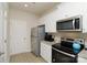 Bright, well-equipped kitchen featuring stainless steel appliances and white cabinets with modern finishes at 2210 Transatlantic Ave, Charlotte, NC 28215