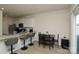 Well-lit kitchen featuring stainless steel appliances, white cabinets, granite countertops and breakfast bar seating at 2210 Transatlantic Ave, Charlotte, NC 28215