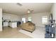 Bright living room with modern fan, neutral walls, couch, and vinyl floors at 2210 Transatlantic Ave, Charlotte, NC 28215