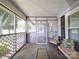 Screened in front porch with lattice and furnishings, creating a cozy outdoor space at 225 N Main St, Mount Pleasant, NC 28124