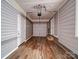 A spacious garage featuring newly installed wood flooring and an automatic door opener for convenient access at 225 N Main St, Mount Pleasant, NC 28124