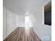 White room featuring wood flooring, white walls, and natural light at 225 N Main St, Mount Pleasant, NC 28124