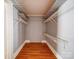 Spacious walk-in closet featuring wire shelving and wood look floors at 225 N Main St, Mount Pleasant, NC 28124