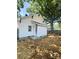 A fully fenced yard and a view of the rear of the home at 229 W Gray Ave, Mooresville, NC 28115