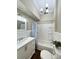 Bathroom with tub/shower combination, beadboard walls, and updated vanity at 229 W Gray Ave, Mooresville, NC 28115