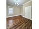 Bedroom featuring hardwood floors and natural light at 229 W Gray Ave, Mooresville, NC 28115