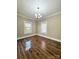 Bedroom featuring hardwood floors, natural light and a stylish ceiling fan at 229 W Gray Ave, Mooresville, NC 28115