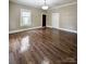 Bedroom featuring gleaming hardwood floors and modern ceiling fan at 229 W Gray Ave, Mooresville, NC 28115
