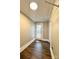 Hallway features hardwood floors and a door leading to the back yard at 229 W Gray Ave, Mooresville, NC 28115