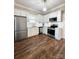 Modern kitchen featuring stainless steel appliances, quartz countertops, and beautiful hardwood floors at 229 W Gray Ave, Mooresville, NC 28115