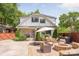 Charming backyard featuring a patio with outdoor furniture, a fire pit, and lush landscaping for relaxed outdoor living at 2304 Commonwealth Ave, Charlotte, NC 28205