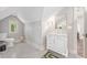 Cozy bathroom featuring a modern vanity, a toilet with black and white mosaic tile flooring, and a bright window at 2304 Commonwealth Ave, Charlotte, NC 28205
