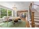 Charming dining room with a chandelier, hardwood floors, and natural light at 2304 Commonwealth Ave, Charlotte, NC 28205