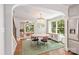 Open-concept dining room with view to the living room, hardwood floors and stainless steel refrigerator at 2304 Commonwealth Ave, Charlotte, NC 28205