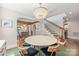 Elegant dining room with a crystal chandelier, hardwood floors, and an open view to other living spaces at 2304 Commonwealth Ave, Charlotte, NC 28205