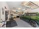 Organized garage featuring epoxy floors, ample storage, a car, and a workout area, maximizing space at 2304 Commonwealth Ave, Charlotte, NC 28205