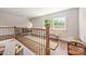 Hallway featuring hardwood floors, a bench, and a decorative trunk creating a functional and inviting space at 2304 Commonwealth Ave, Charlotte, NC 28205