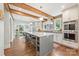 Spacious kitchen featuring stainless appliances, breakfast bar, and an opening to a formal dining room at 2304 Commonwealth Ave, Charlotte, NC 28205