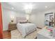 Elegant main bedroom with a unique chandelier and a view into the modern kitchen at 2304 Commonwealth Ave, Charlotte, NC 28205