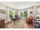 Bright home office with hardwood floors, large windows, and neutral paint, perfect for working from home at 2304 Commonwealth Ave, Charlotte, NC 28205