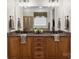 A luxurious bathroom boasts a granite countertop, double sinks, and a large mirror for a bright and spacious feel at 2817 Bevis Ln, Waxhaw, NC 28173