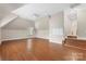 Spacious bonus room with hardwood floors, large window, and neutral paint, perfect for versatile use at 2817 Bevis Ln, Waxhaw, NC 28173