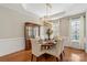 Formal dining room with wainscoting, chandelier, table, and chairs at 2817 Bevis Ln, Waxhaw, NC 28173