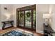 Welcoming entryway features wood framed glass doors and stylish decor, creating a warm first impression at 2817 Bevis Ln, Waxhaw, NC 28173