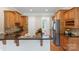 Spacious kitchen with island, granite countertops, stainless appliances, and wood cabinetry at 2817 Bevis Ln, Waxhaw, NC 28173