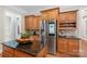 Kitchen with stainless steel appliances, a kitchen island, granite countertops, and modern refrigerator at 2817 Bevis Ln, Waxhaw, NC 28173