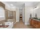 Main bathroom showcasing double sink vanity, soaking tub, tile floors, and a tiled shower at 2817 Bevis Ln, Waxhaw, NC 28173