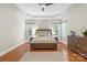 Spacious main bedroom showcasing tray ceiling, hardwood floors, and large windows at 2817 Bevis Ln, Waxhaw, NC 28173